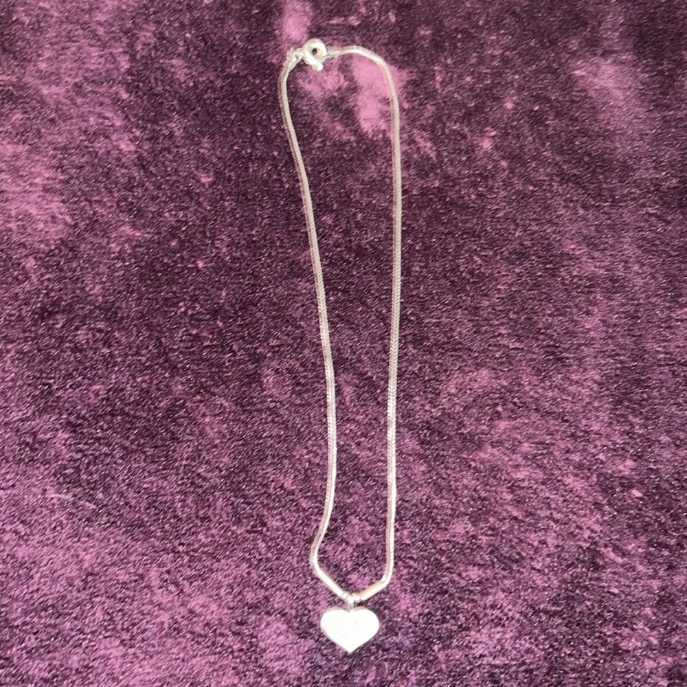 Sterling silver heart pendant necklace.